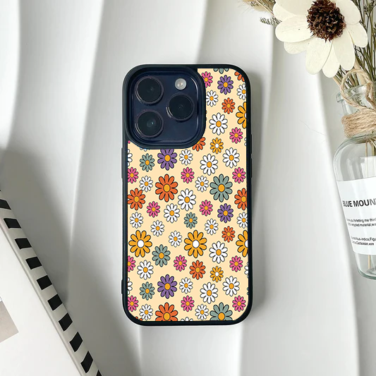 Phone case covered in a small, colorful retro daisy pattern on a cream background.